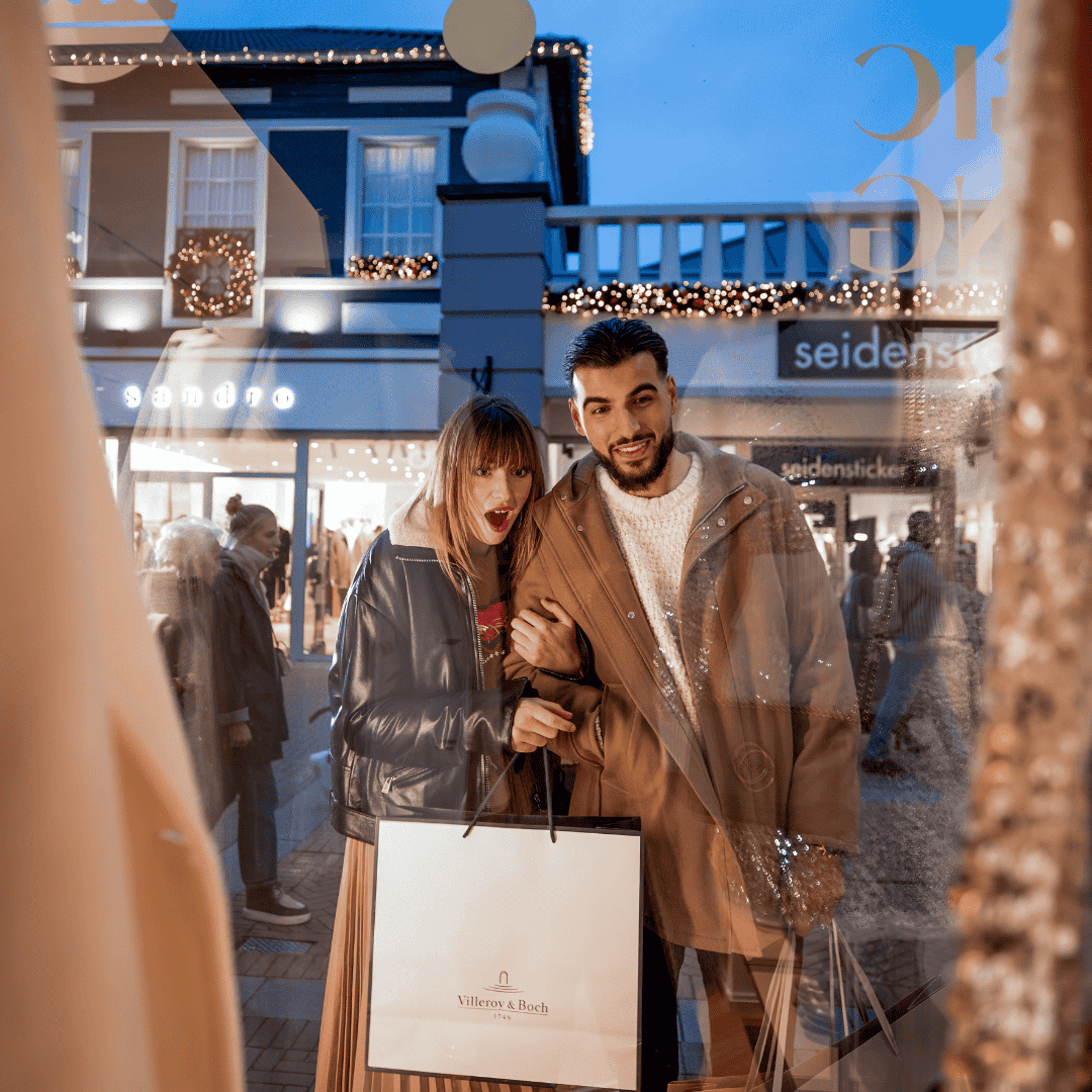 Couple window shopping at Designer Outlet Roermond