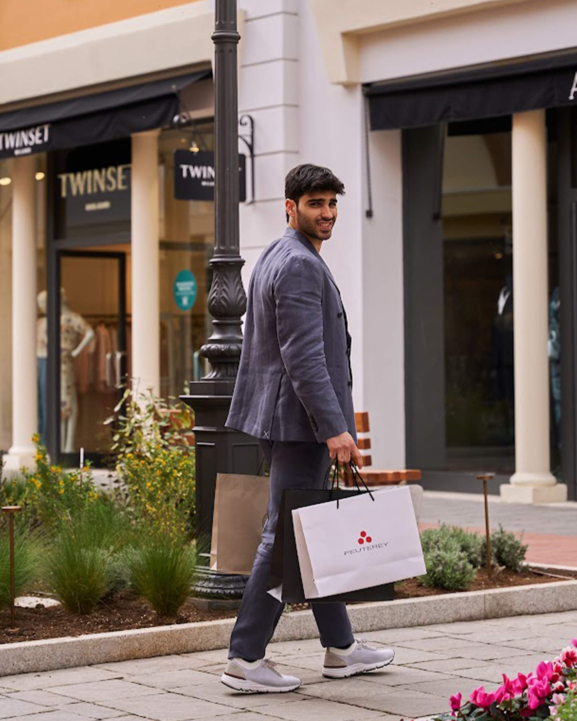 a boy with 2 bags